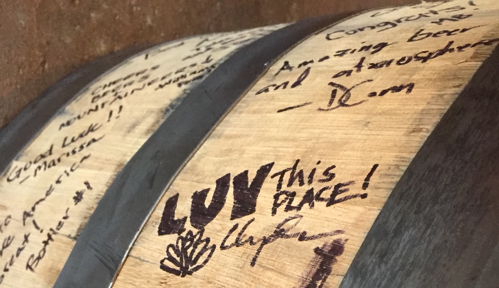 A barrel signed by visitors: Luv this place